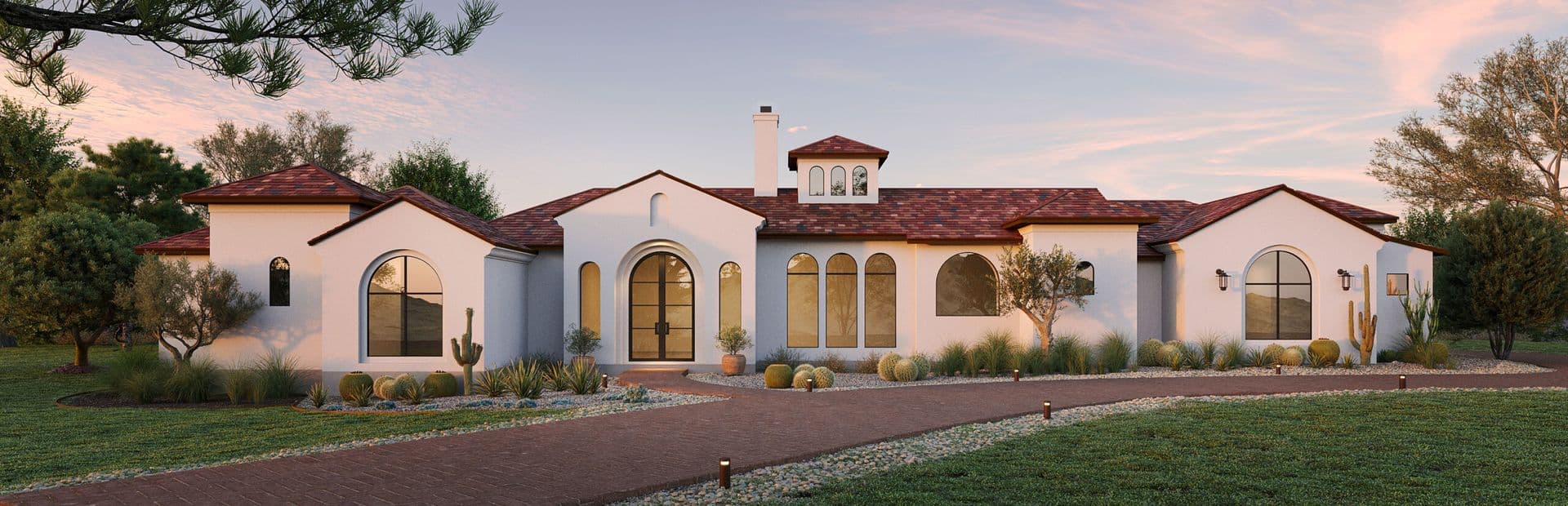 2,500 sq ft Santa Barbara-style landscaping in Texas featuring a winding terracotta-colored paver path with pebble borders, a lawn, and xeriscape planting with large Golden Barrel cacti and a prominent Saguaro cactus on the left.