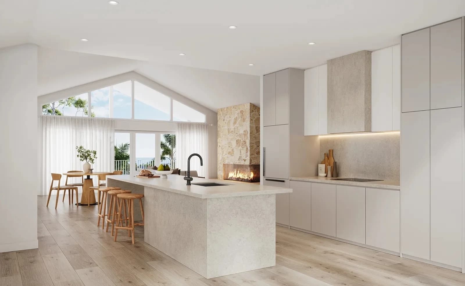 Open-plan kitchen render with stone fireplace, vaulted ceiling, and ocean-view dining beyond — Dalys Cour Duplex, Coledale NSW